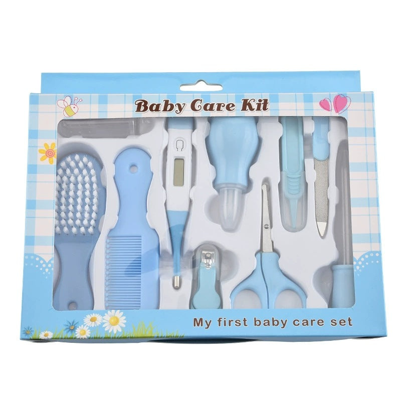 Baby care kit packaging with various tools on a white background