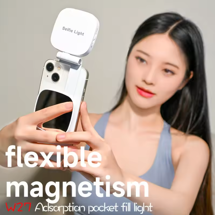 Woman using a phone with a selfie light attachment, text highlighting 'flexible magnetism' and product name.