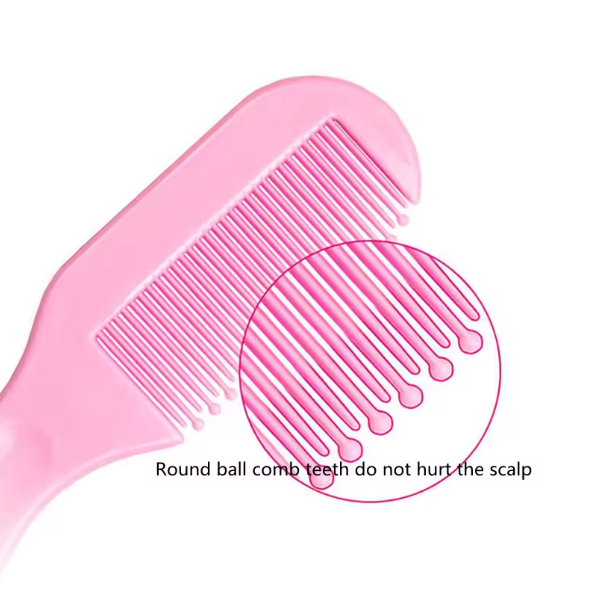 Pink hair comb with close-up of teeth on a white background