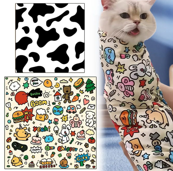 Cat wearing a colorful patterned Magic Pet Wrap with cow print and cartoon designs.